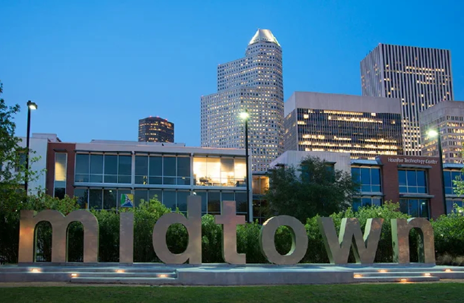 Midtown Houston illuminated sign at night — family law attorney Houston TX serving Midtown divorce and custody cases
